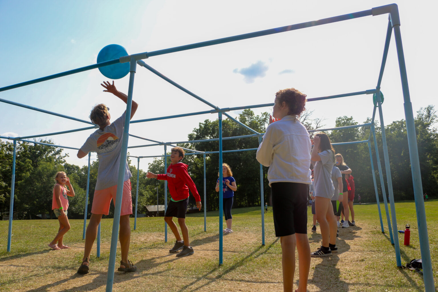 A group of kids playing 9 Square at an Iowa summer camp.